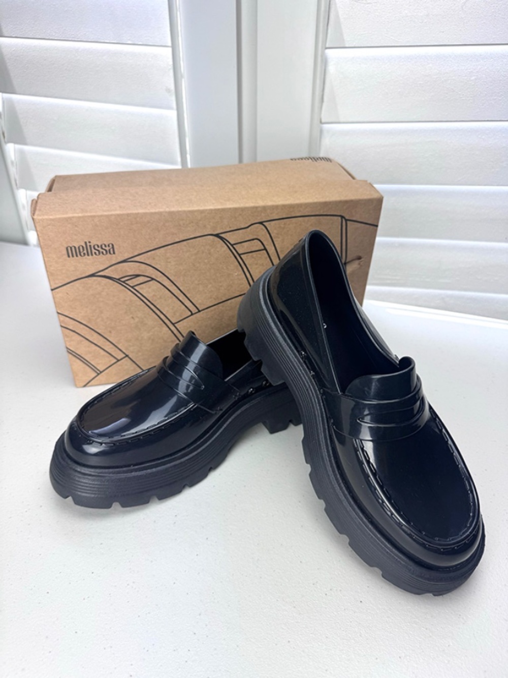 The Melissa Royal Loafers with a High-Shine Finish and a Chunky Platform Size 7